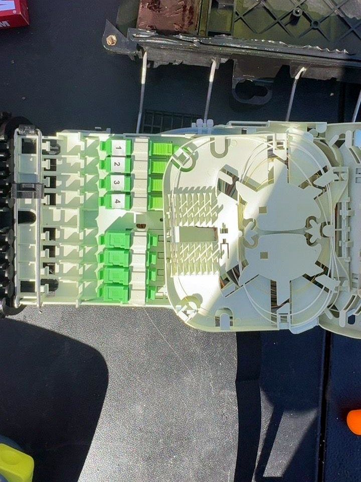 Fiber splice tray with green SC/APC adapters